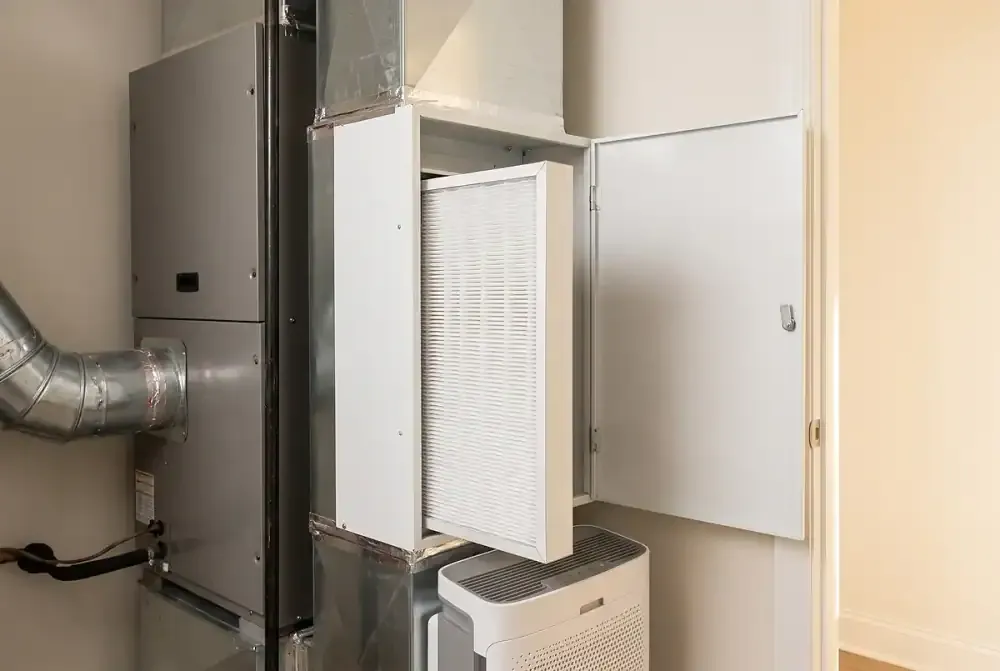 Whole-home air purifier and media filter cabinet installed beside the air handler
