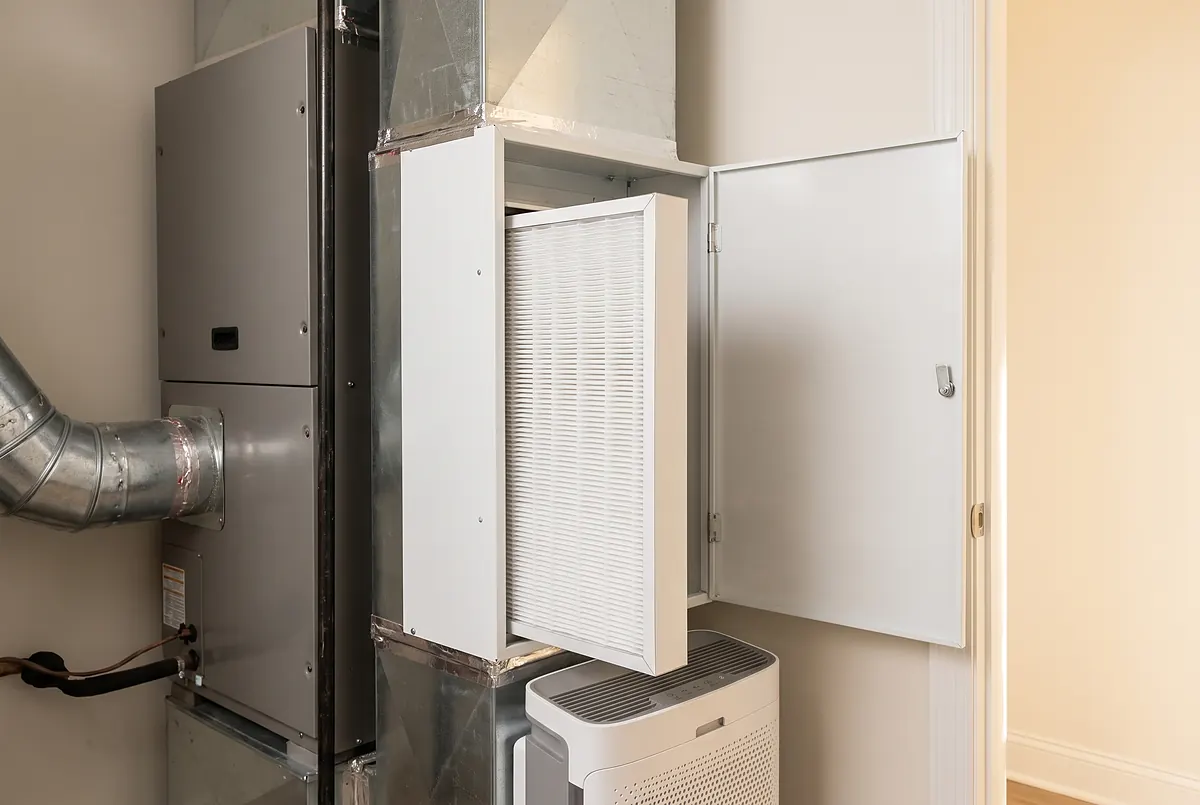 Whole-home air purifier and media filter cabinet installed beside the air handler