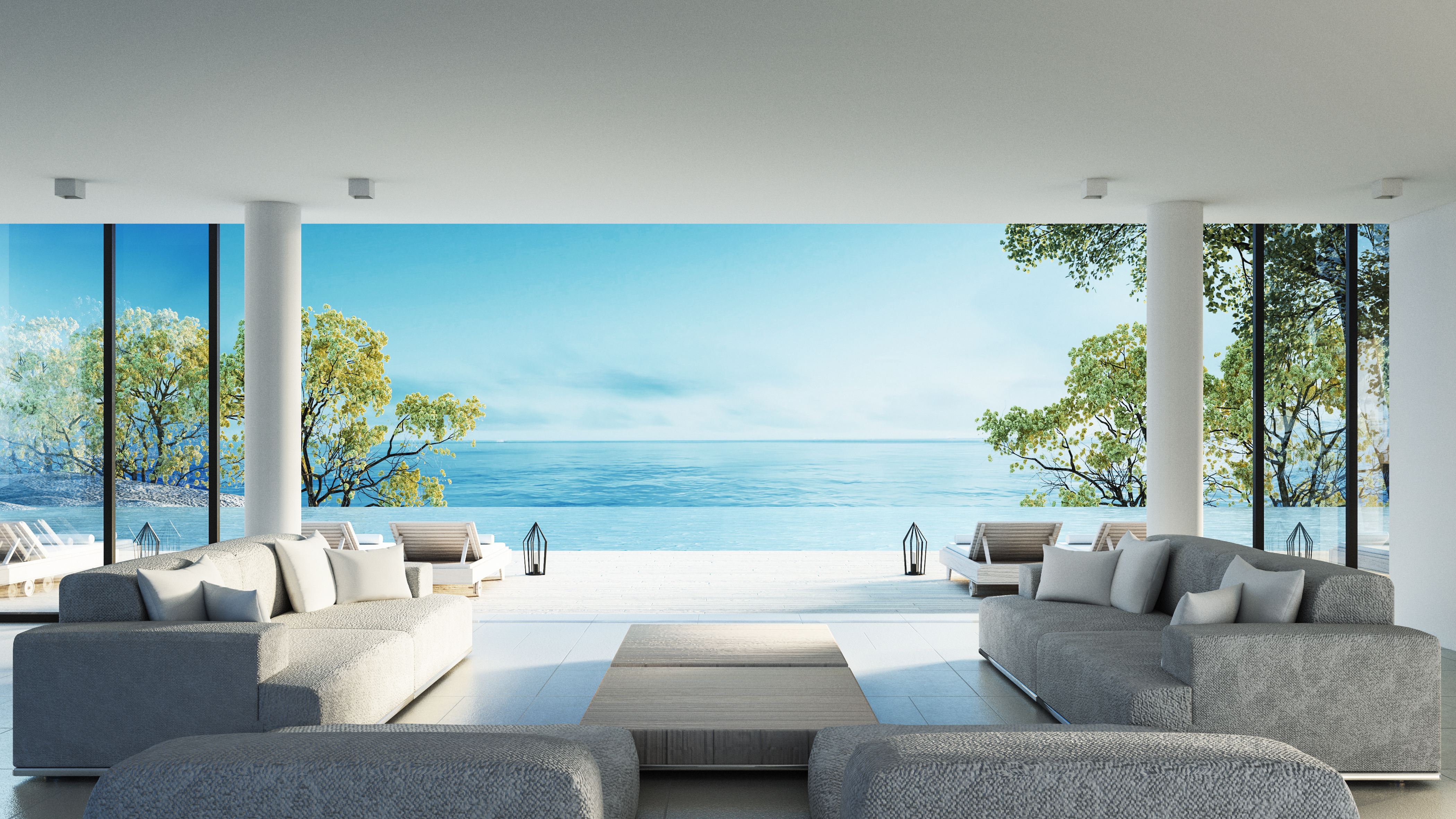 Electronic air cleaners displayed in a modern indoor setting with large windows showcasing a serene ocean view, emphasizing air filtration services in Phenix City, AL.